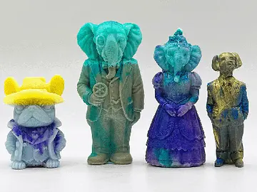 A set of colourful finished soaps shaped like quirky figurines, including animals and dressed characters, displayed after a soap making workshop. The unique designs and vibrant colours highlight the creative and playful experience of a hens party or group soap making class.